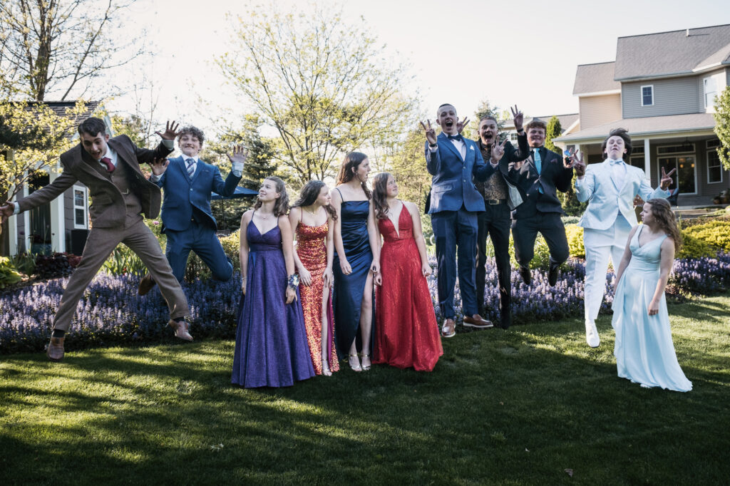 prom group celebrate jump